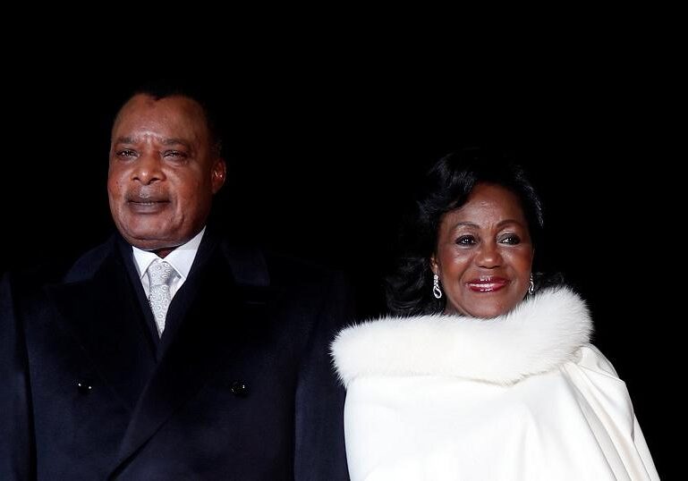 President Denis Sassou Nguesso and First Lady Antoinette Sassou Nguesso elegantly attending a formal event, showcasing their poised and dignified presence.