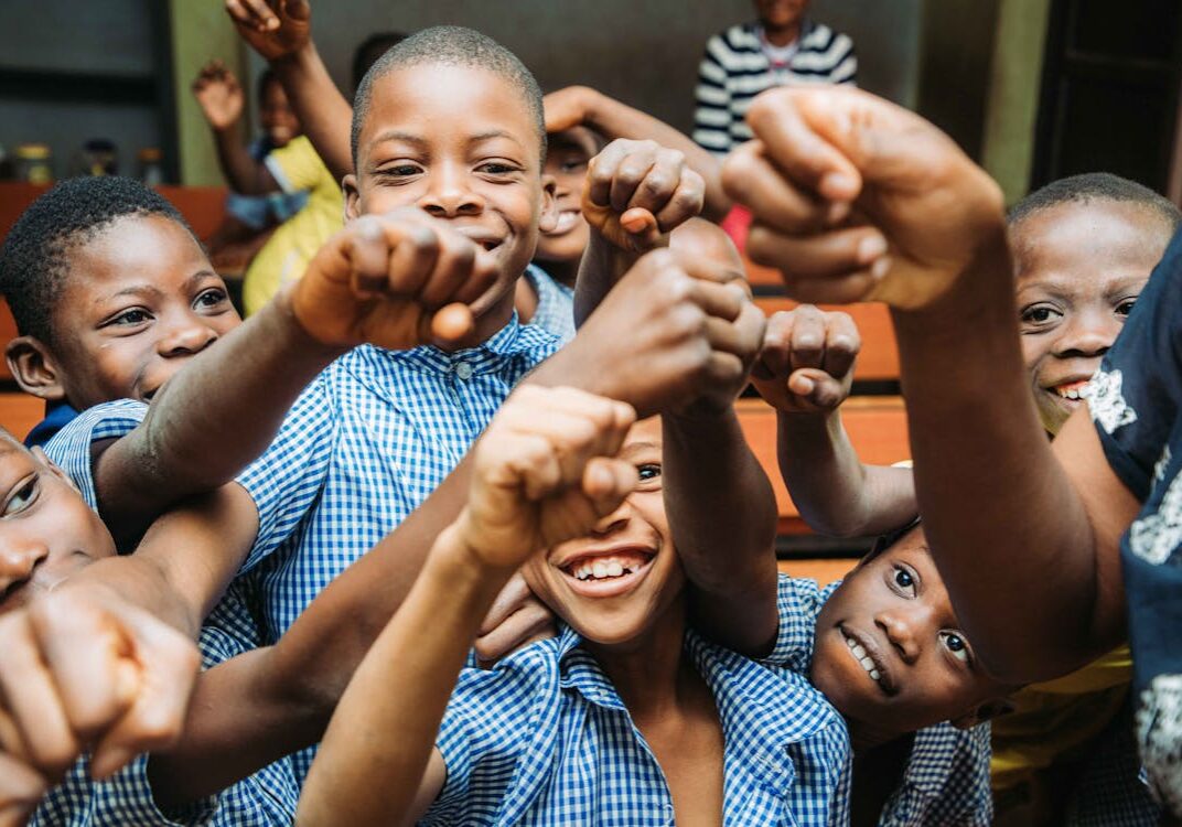 free-photo-of-a-group-of-kids-holding-their-fists-up-and-smiling free-photo-of-a-group-of-kids-holding-their-fists-up-and-smiling